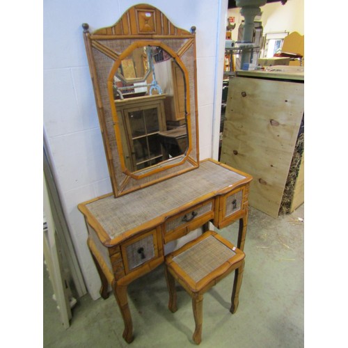 1389 - A hardwood and rattan dressing table, 77cm high, 95 x 41cm together with an associated wall mirror a... 