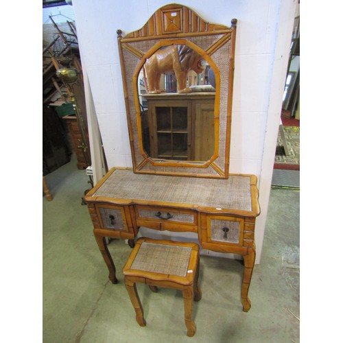 1389 - A hardwood and rattan dressing table, 77cm high, 95 x 41cm together with an associated wall mirror a... 