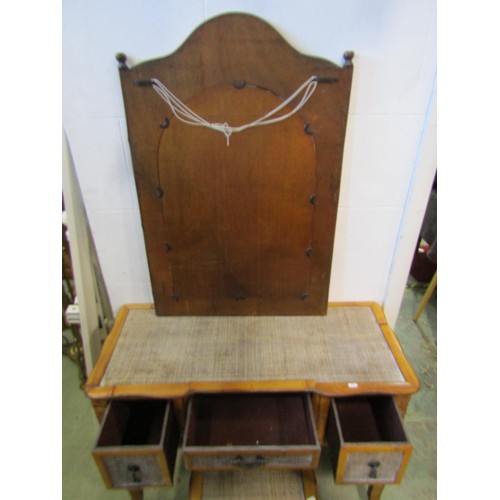 1389 - A hardwood and rattan dressing table, 77cm high, 95 x 41cm together with an associated wall mirror a... 