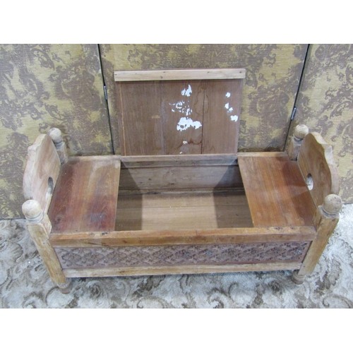 1390 - A small carved weathered teakwood box settle / commode, 55cm high, 97 x 40cm.