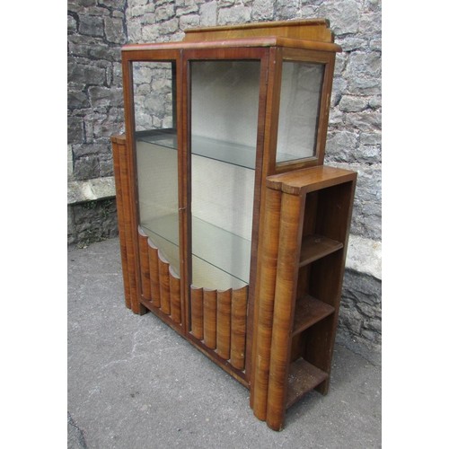 1398 - An Art Deco walnut display cabinet, with glazed panelled doors and stepped mounts enclosing addition... 