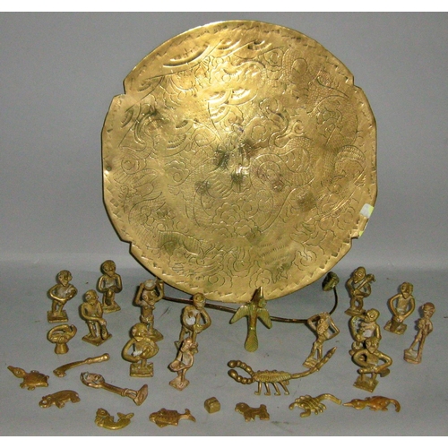 436 - A mixed selection of Middle and Far Eastern brass dishes, bowls, brass African farming figures, a co... 