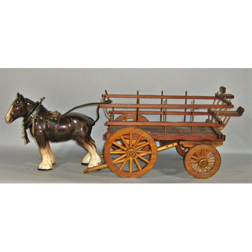 535 - A model traditional gypsy caravan pulled by a Beswick type horse together with a model wooden cart p... 