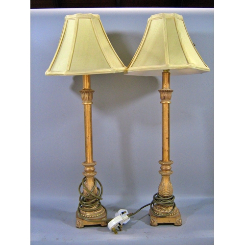 541 - A pair of wooden turned table lamps and a pair of candlestick table lamps, all with shades.