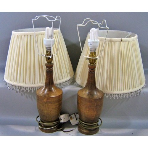 541 - A pair of wooden turned table lamps and a pair of candlestick table lamps, all with shades.