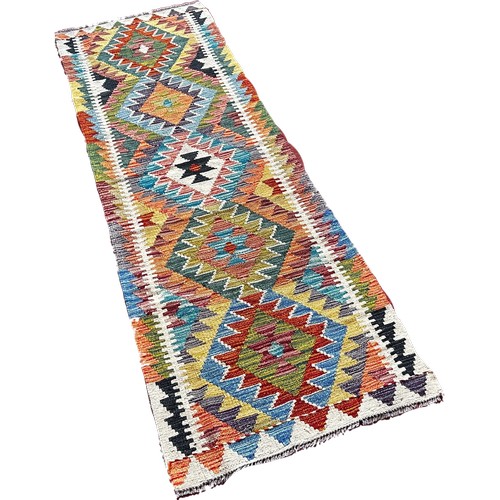 1756 - A Chobi kilim runner with a central row of stepped medallions   195cm x 63cm