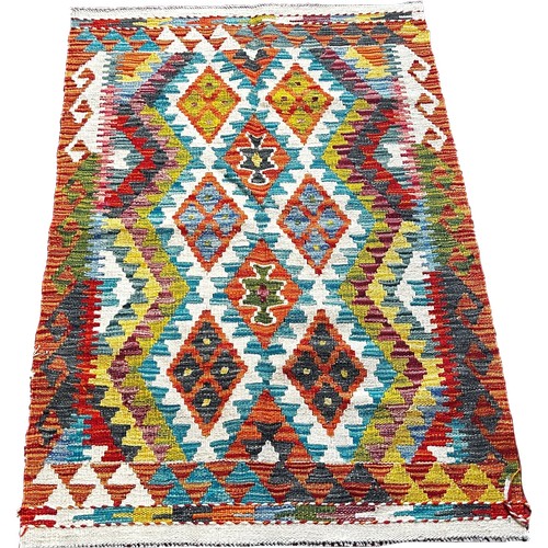 1769 - A Chobi kilim rug with alternating rows of diamonds  122cm x 83cm approximately