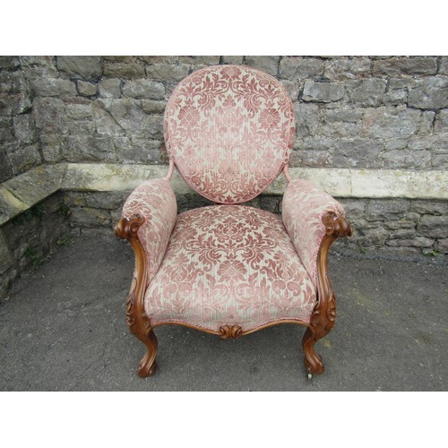 1444 - A Victorian walnut drawing room chair with carved and moulded showwood frame with re-upholstered fin... 