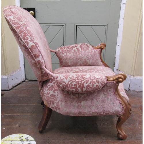 1444 - A Victorian walnut drawing room chair with carved and moulded showwood frame with re-upholstered fin... 