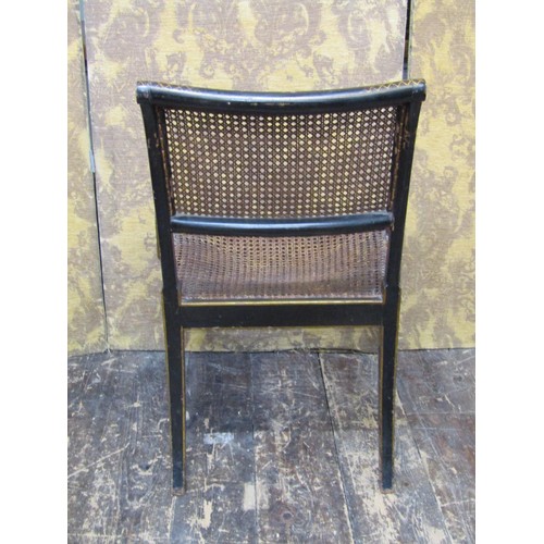 1448 - A Regency lacquered bergere chair on swept supports