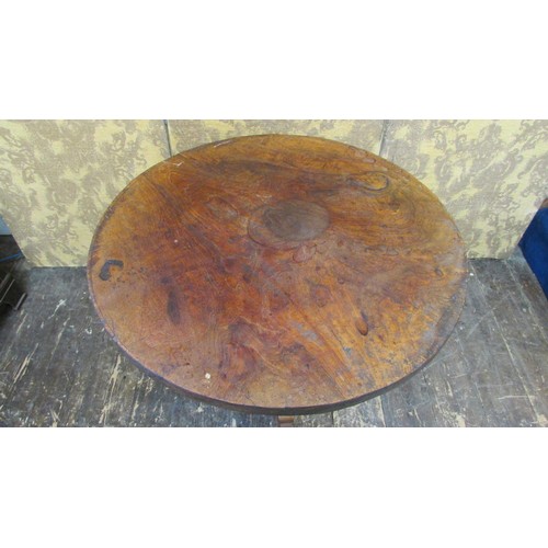 1458 - A 19th century occasional table in teak the heavy circular top raised on a turned pillar and tripod,... 