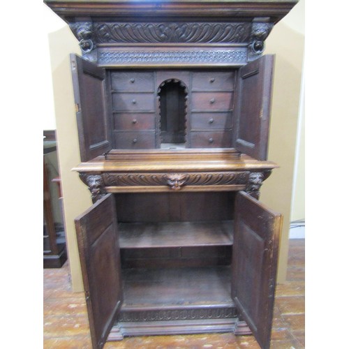 1461 - 19th century Gothic revival carved oak two sectional side cupboard the front elevation with profusel... 