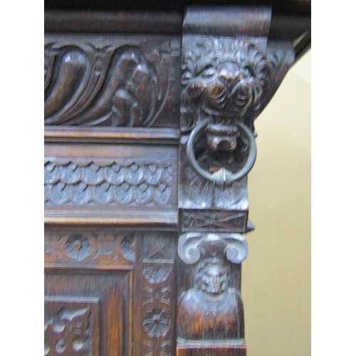 1461 - 19th century Gothic revival carved oak two sectional side cupboard the front elevation with profusel... 