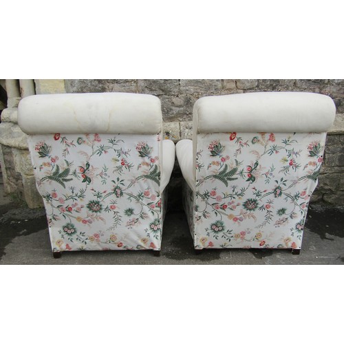 1465 - A pair of traditional easy chairs with scrolled arms and backs, simple upholstered finish, raised on... 