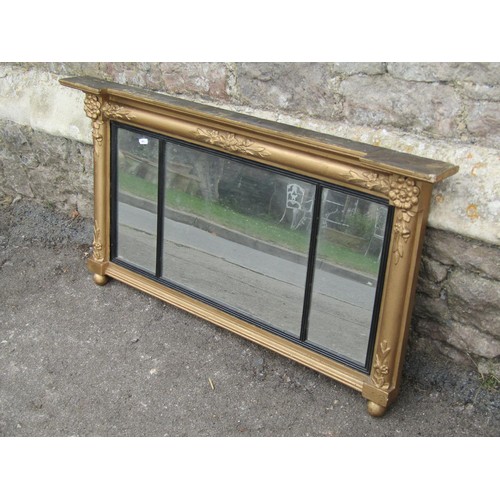 1415 - A Regency style gilt framed overmantel mirror with ebonised borders, 54 x 100cm.