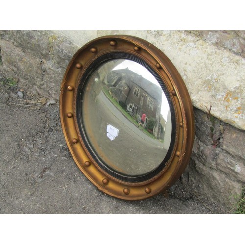 1424 - A Regency style gilt framed convex wall mirror, 47cm diameter.