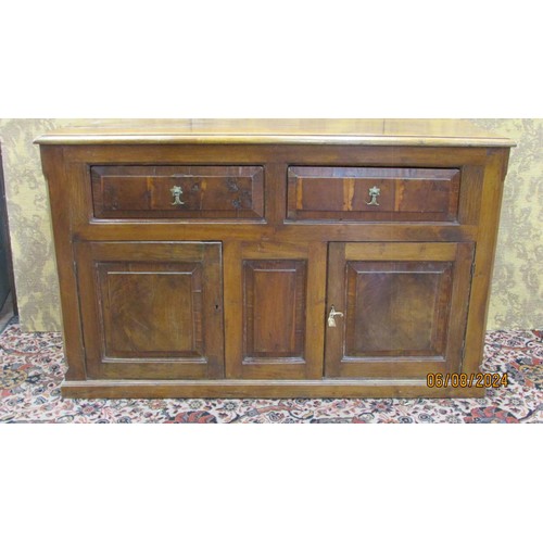 1481 - An antique sideboard in mixed woods to include yew wood enclosed by two panelled doors and two friez... 