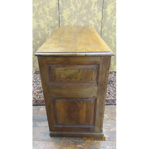 1481 - An antique sideboard in mixed woods to include yew wood enclosed by two panelled doors and two friez... 