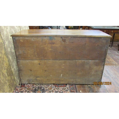 1481 - An antique sideboard in mixed woods to include yew wood enclosed by two panelled doors and two friez... 