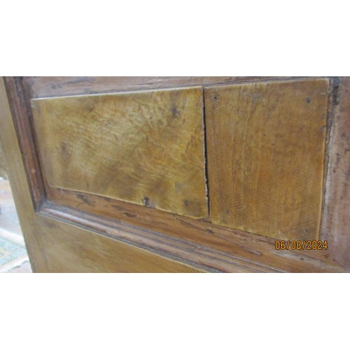 1481 - An antique sideboard in mixed woods to include yew wood enclosed by two panelled doors and two friez... 