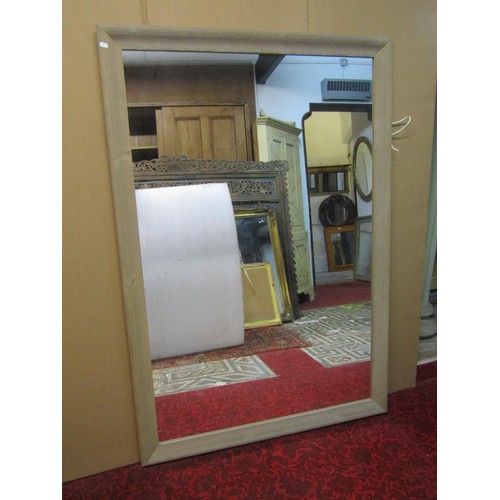 1426 - A large contemporary wall mirror in a simple limed wooden frame, 153 x 104cm.