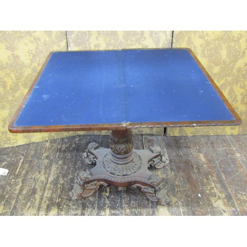 1489 - A good quality Regency rosewood fold over top card table, raised on a tapering column with acanthus ... 