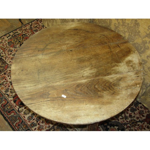 1493 - An antique oak cricket table, the circular top over a triangular under gallery, 84cm diameter, 52cm ... 