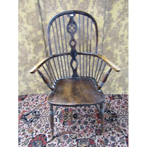 1494 - A Windsor elbow chair with elm seat, shaped and pierced splat on turned supports