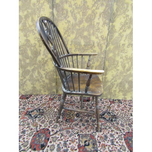 1494 - A Windsor elbow chair with elm seat, shaped and pierced splat on turned supports