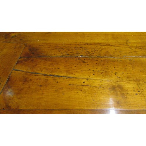 1497 - A 19th century French provincial fruitwood farmhouse dining table with banded planked top over two f... 