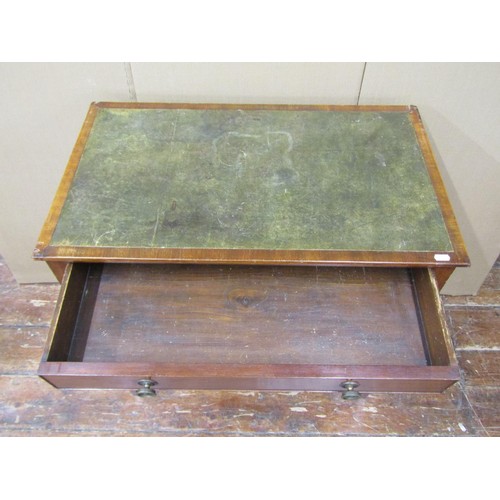 1504 - A 19th century mahogany writing table with inset top, over a frieze drawer and square tapered legs, ... 