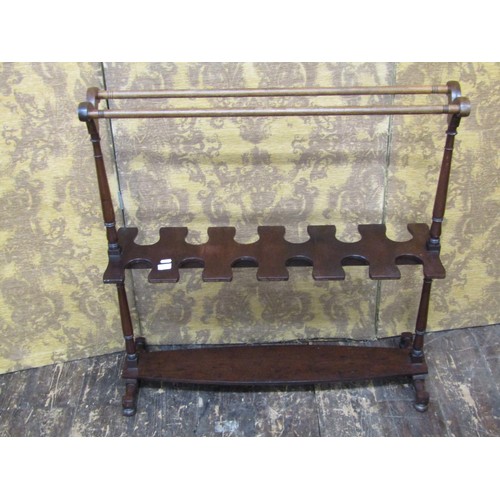 1513 - A Regency boot rack for six pairs of hunting boots, raised on a boat shaped frame with turned mouldi... 