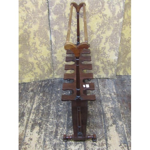 1513 - A Regency boot rack for six pairs of hunting boots, raised on a boat shaped frame with turned mouldi... 