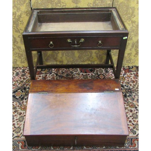 1514 - A Georgian mahogany writing desk on stand, the rising lid revealing a fitted interior of drawers and... 