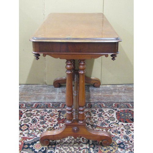 1517 - A 19th century mahogany side table, enclosing a frieze drawer, raised turned supports united by a tu... 