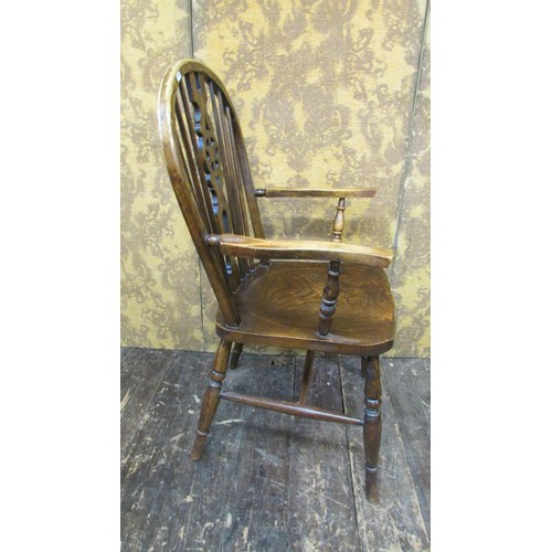 1520 - A Windsor wheelback elbow chair in elm and beechwood