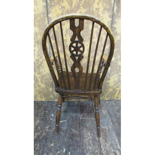 1520 - A Windsor wheelback elbow chair in elm and beechwood