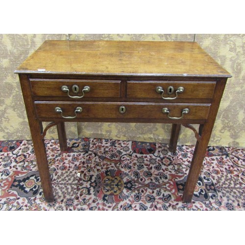 1530 - A George III oak side table incorporating three drawers on square cut supports, 72cm high, 80 x 46cm