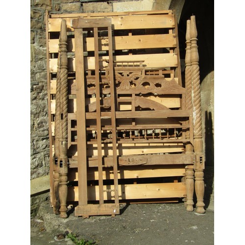 1538 - A 19th century Indian four poster bedstead in teak with spiral column supports, spindle moulded and ... 