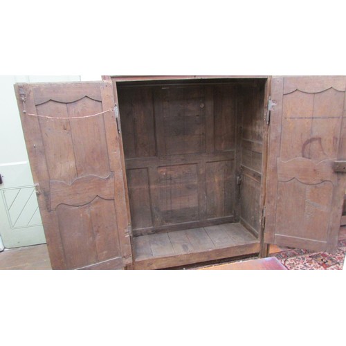 1539 - An 18th century Flemish oak hanging cupboard with panelled frame, the doors enclosing shaped and mou... 