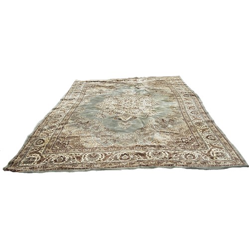 1748 - A Persian style carpet with a central floral medallion on a pale green ground, 350cm x 270cm approxi... 