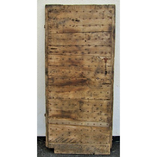 1542A - An early English iron studded planked oak door, 201 x 91cm