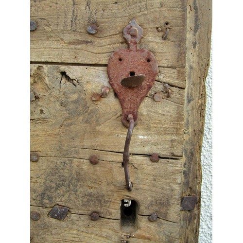 1542A - An early English iron studded planked oak door, 201 x 91cm