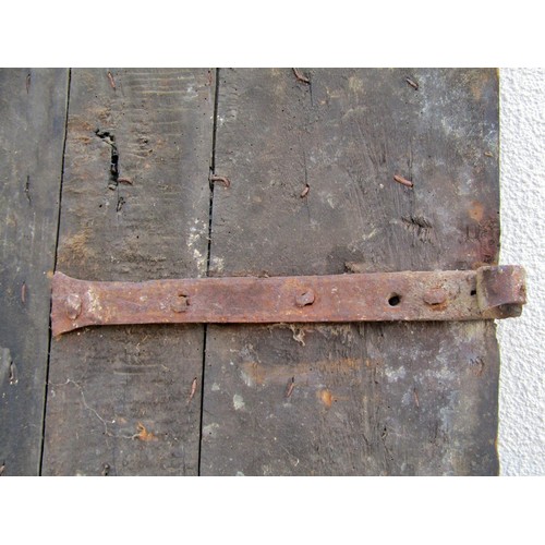 1542A - An early English iron studded planked oak door, 201 x 91cm