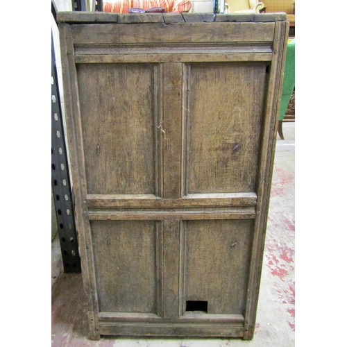 1543 - A large early oak side cupboard, with hinged panelled doors enclosing a shelved interior, 113cm high... 