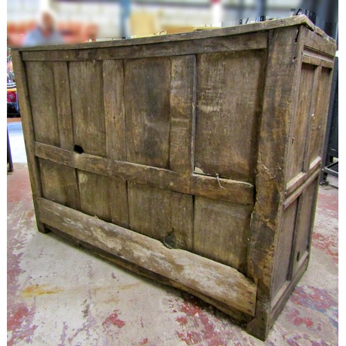 1543 - A large early oak side cupboard, with hinged panelled doors enclosing a shelved interior, 113cm high... 