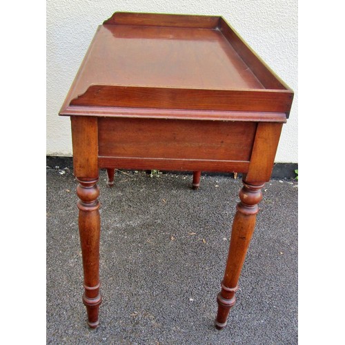 1546 - A 19th century mahogany side table with raised gallery over a pair of frieze drawers, raised on turn... 