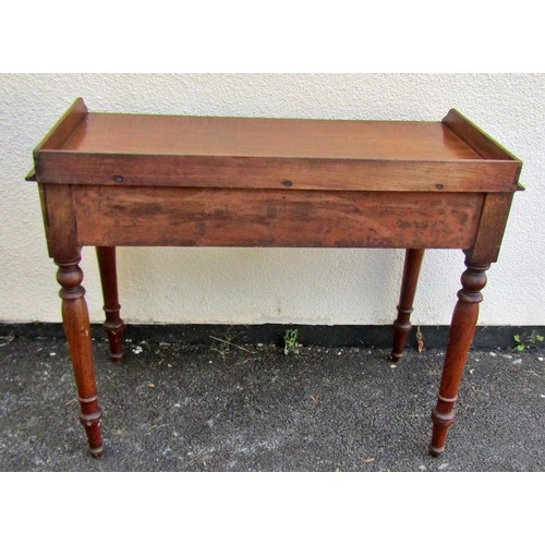 1546 - A 19th century mahogany side table with raised gallery over a pair of frieze drawers, raised on turn... 