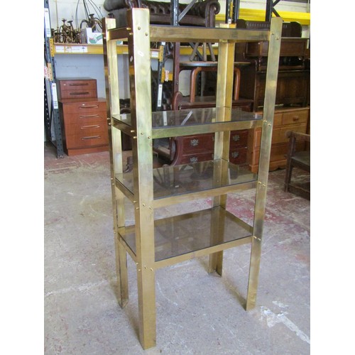 1551A - A 20th century Italian design four tier brass framed whatnot  fitted with smoked glass shelves, 153c... 