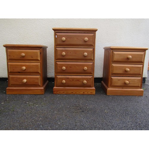 1555 - A pair of pale pine three drawer bedside chests, 67cm high, 50 x 46cm, together with a similar four ... 